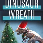 Pin: How to make a fun dinosaur Advent wreath, with image of a T-Rex in a Santa hat trying to hang the lights on a mini Christmas tree.