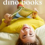 Pin: 19 fun dino books, with image of a child in a yellow to reading, photo taken from above