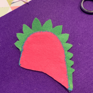 Stegosaurus egg cosy all stitched along its back.