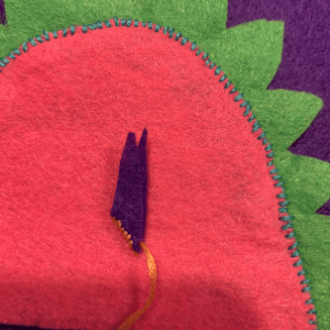 Tail spike folded in two and a few stitches placed along the fold.