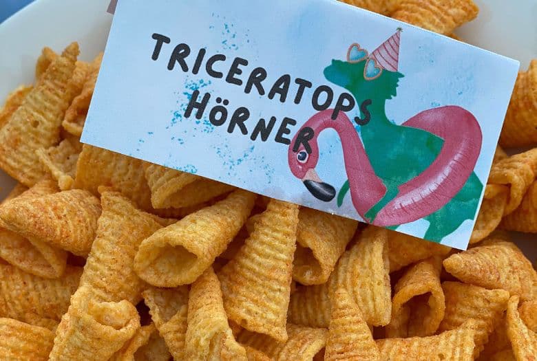 Triceratops horns (Nacho Bugles) with a sign to match our invitations and thank you cards.