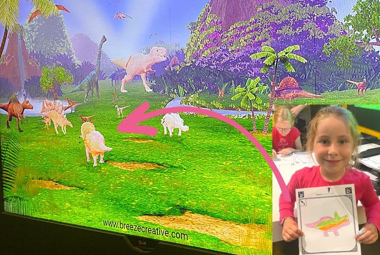 With the help of special software, little dinosaur fans can colour in one of the dinosaurs and then scan it in to have their dinosaur pop up on the screen and move around for everyone to see. This is our LDA with her Triceratops.